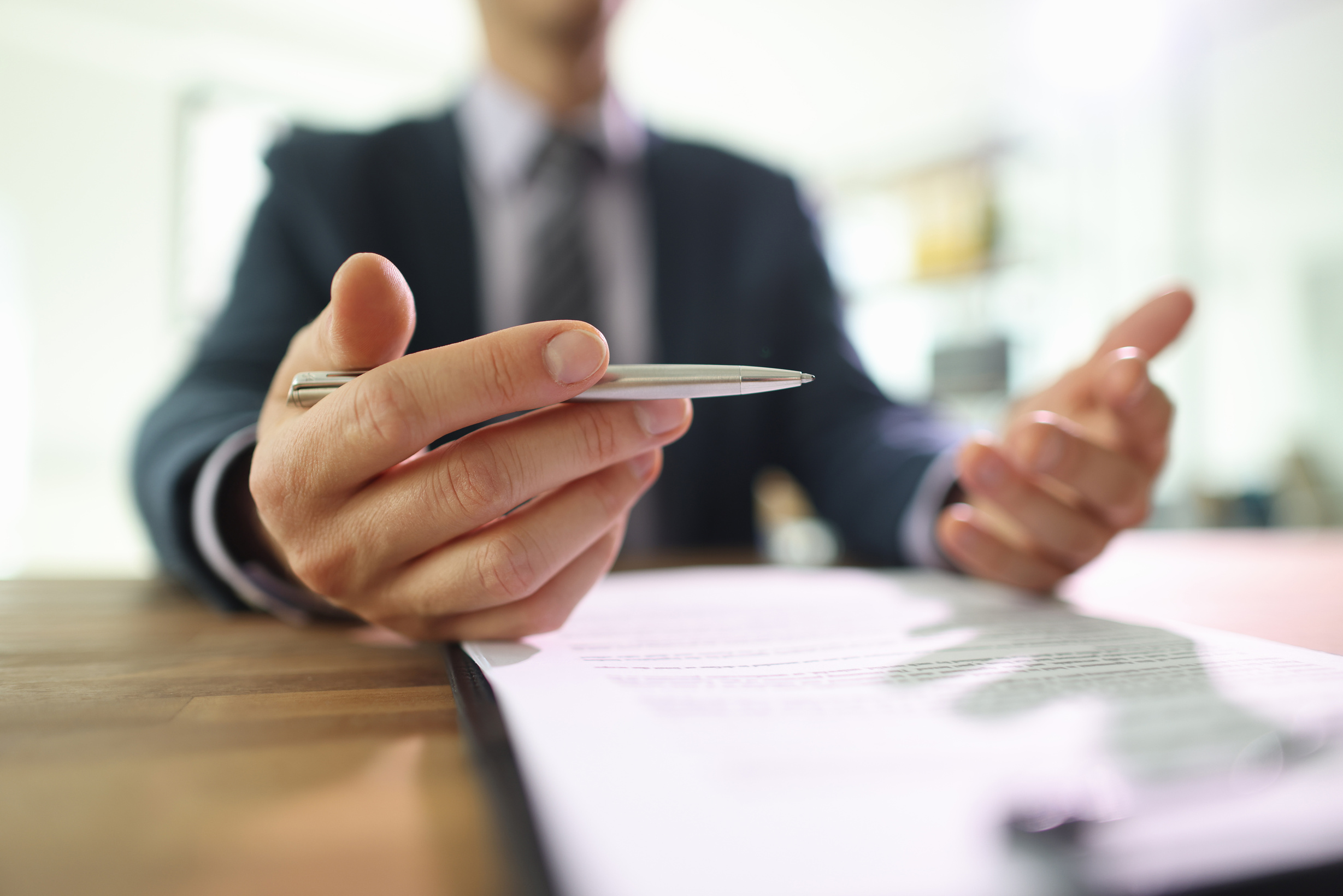 Businessman Discusses Terms and Conditions of Agreements